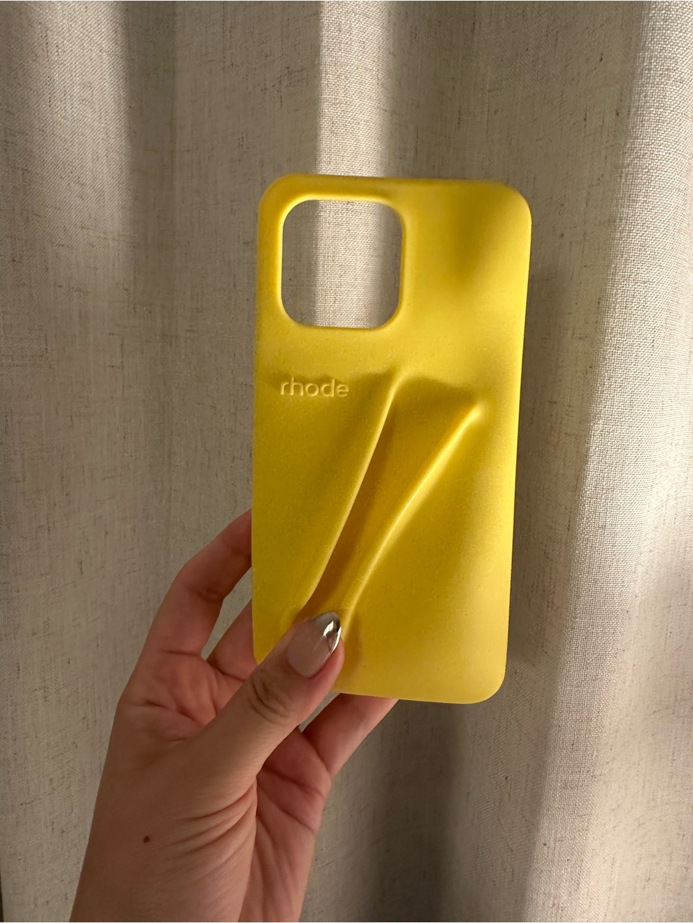 RHODE Sculpted Yellow Phone Case with Textured Wave Design